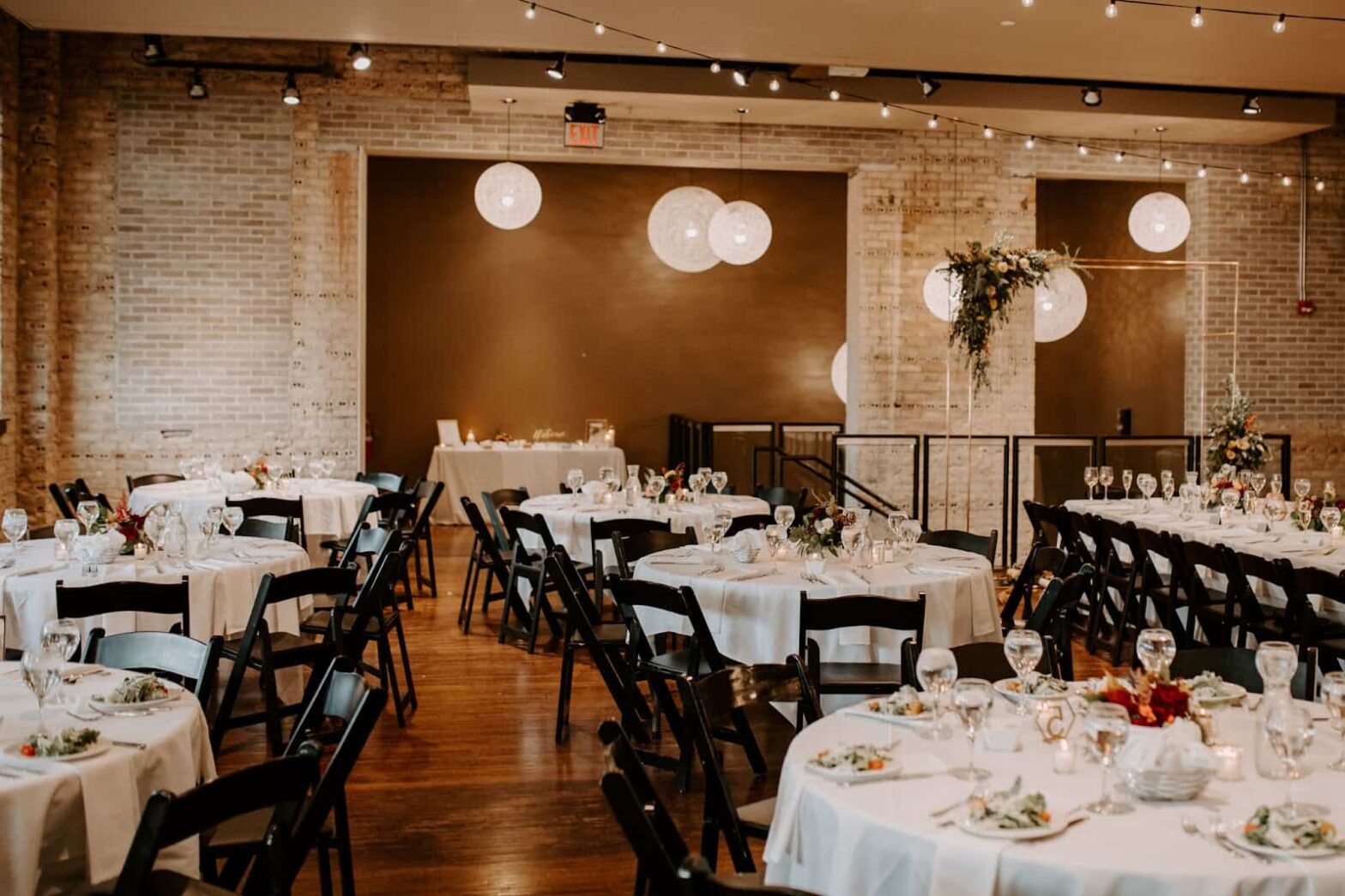 Setting up a wedding venue with tables and chairs.
