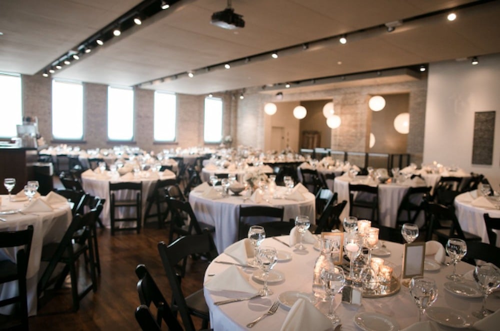 Tables setup for a wedding reception at FIVE Event Center